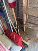 In corner includes US flag, trap, chair cushions, window scrapers , yard tools, 5’ wooden painters ladder