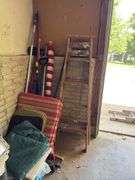 In corner includes US flag, trap, chair cushions, window scrapers , yard tools, 5’ wooden painters ladder