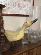 On ledge includes decorative vases, individual cheese bowls, candle holder, a goose and more