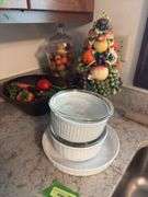 Various fruit decor and three casserole dishes