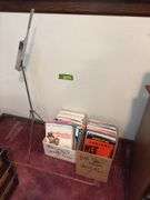 Sheet music and variety of music books, music stand