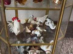 9” tall glass curio cabinet with miniatures