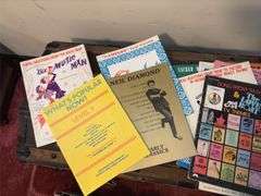 Sheet music and variety of music books, music stand
