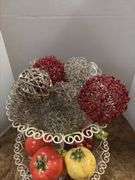 Decorative stand with wire balls and ceramic fruit