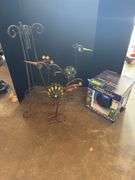 Two decorative yard birds and gazing ball with stand