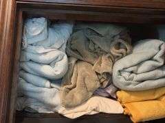 Top 3 shelves includes blankets, towels, hand towels, etc