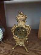 Clocks including a very nice metal ornate wind up clock w/ beveled glass, classic alarm clock
