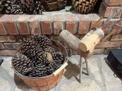 Baskets of pine cones and a wooden reindeer