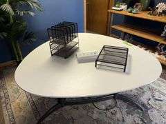 60x29 Formica topped conference  table, egg shaped, with power outlet and office file holders