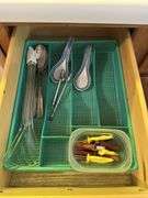 4 kitchen drawers marked "A" with flatware and kitchen utensils