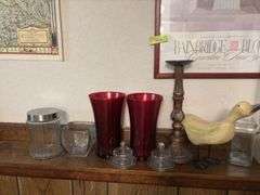 On ledge includes decorative vases, individual cheese bowls, candle holder, a goose and more