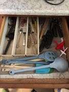 Kitchen utensils, plastic storage containers, cleaning supplies “E” cupboards