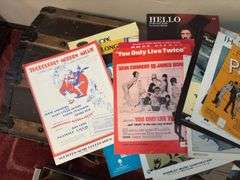 Sheet music and variety of music books, music stand