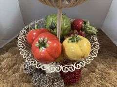 Decorative stand with wire balls and ceramic fruit