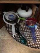 Kitchen utensils, plastic storage containers, cleaning supplies “E” cupboards