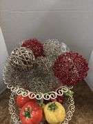 Decorative stand with wire balls and ceramic fruit