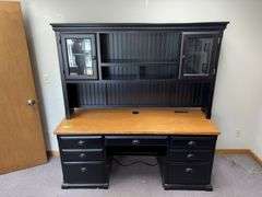 24D x 68L x 72H two piece credenza with hutch on top Has flip down keyboard tray, three drawers on left side and single door on right . Matches desk in lot 11487