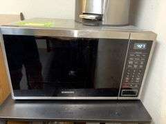Samsung microwave, stainless steel trash can, rolling shelf unit, etc