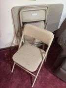 Four Cosco folding chairs and matching table