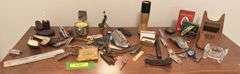 Assorted smalls includes merscham style pipe, ice cleats, pocket knives, old razor, bullets, gal on leg nut cracker, ash tray set w/matching holder and more