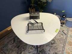 60x29 Formica topped conference  table, egg shaped, with power outlet and office file holders