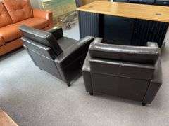 Two pleather arm chairs
