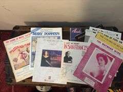Sheet music and variety of music books, music stand