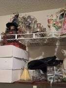 Contents of bedroom 1 closet include holiday decor, empty jewelry box, hangers, etc The white boxes are empty!