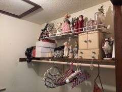 Contents of bedroom 1 closet include holiday decor, empty jewelry box, hangers, etc The white boxes are empty!
