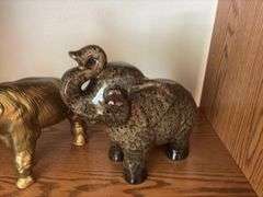 Ceramic and heavy brass elephants