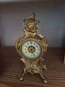 Clocks including a very nice metal ornate wind up clock w/ beveled glass, classic alarm clock