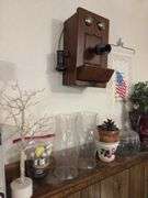 On ledge includes Jones Soda Co Seattle Seahawks collector pack, Easter tree, planters, hurricane shades, etc