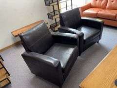 Two pleather arm chairs