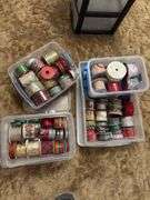 Several rolls of ribbons in totes