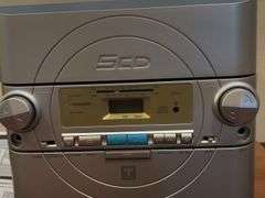 Trutech 5 cd player/AM/FM, speakers and stand.