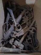 Antique car headlight, ear notcher, horse shoes, horse bits and wrenches etc...