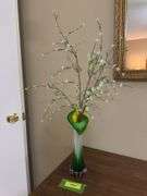 Jack in the Pulpit style glass stretch vase and genuine plastic flowers, not imitation plastic but genuine!!!