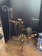 Two decorative yard birds and gazing ball with stand