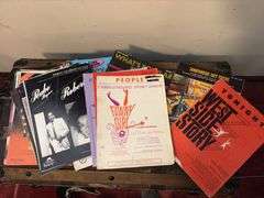 Sheet music and variety of music books, music stand