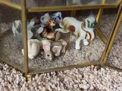 9” tall glass curio cabinet with miniatures