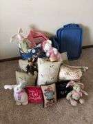 Pillows, stuffed rabbits and two totes to haul them home in