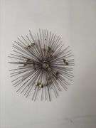 Sunburst style metal wall hanging
