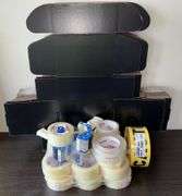 Quantity of Staples brand packing tape, dispensers, boxes, 500’ roll CAUTION tape