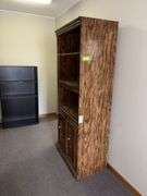 18D x 31L x 75H bookcase with three shelves and double door lower storage