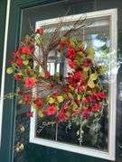 Two cement planters with decor, lantern,  “believe” stone, door wreath