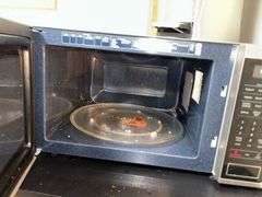 Samsung microwave, stainless steel trash can, rolling shelf unit, etc