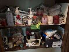 Bottom two shelves includes many candles, soaps, hand towels, etc