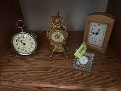 Clocks including a very nice metal ornate wind up clock w/ beveled glass, classic alarm clock