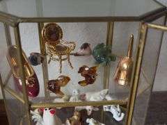 9” tall glass curio cabinet with miniatures