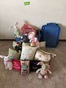 Pillows, stuffed rabbits and two totes to haul them home in